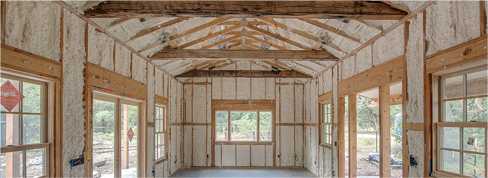 Spray foam installed along the walls and ceiling of a new build home