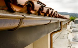 Copper gutters installed along a roof.